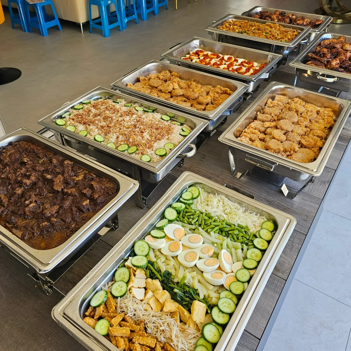Bain-marie trays filled with Indonesian dishes