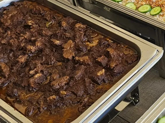 A tray of slow-cooked beef rendang